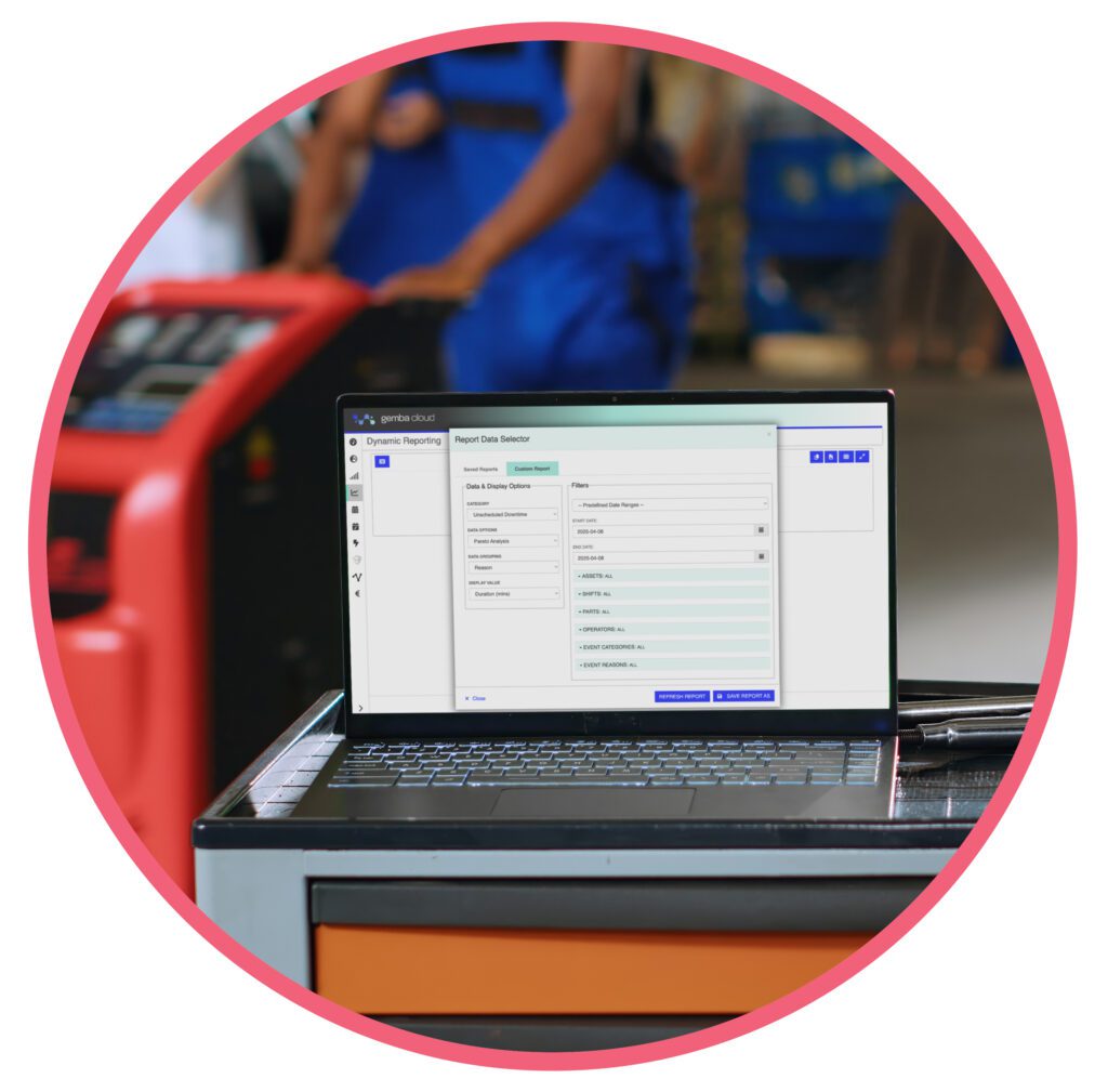 Gemba Cloud software open on a laptop, showing dynamic reporting options on a factory floor.