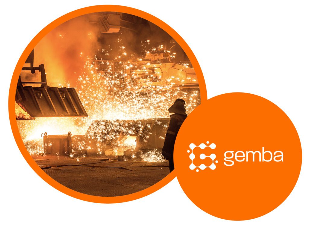 Gemba logo alongside a steelworker in protective gear near molten metal during production