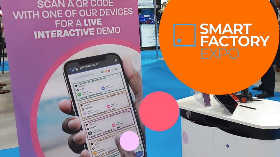 Smart Factory Expo 2025 demo stand showing a Gemba Cloud mobile form interface and interactive signage.